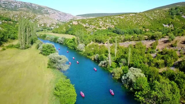 Flight over the Zrmanja river by rafting boats near Zadar in Croatia 4K
