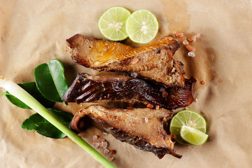 Ikan panggang or ikan pari asap is stingray fish preserved by fumigation. Smoked stingray fish sell in the traditional market in Indonesia. It's can be processed into a variety of delicious foods.