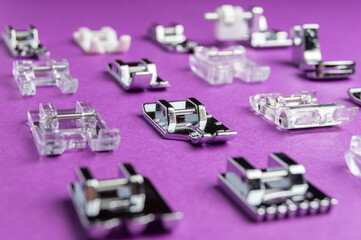 Presser feet for sewing machines on a colored background