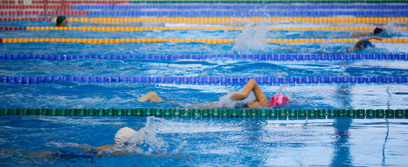 children athletes swim in the pool workout - 397202548