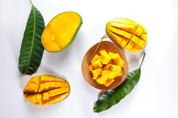 Mangga or Mango ripe with nicely cut pieces on a wooden plate.