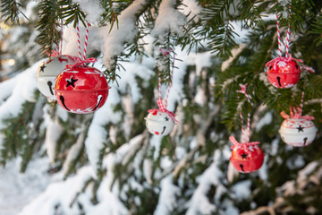 Merry Christmas decorations, winter background, spruce tree with baubles in snow