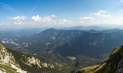 Fototapeta premium Wonderful view of Otscher valley and the surrounding mountains at daily light. Mount Otscher is a prominent peak in south-western Lower Austria. Suburbs of the Austrian alps. Known tourist spot