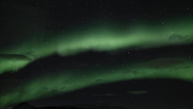 Auroras dancing across the sky, slow pan right