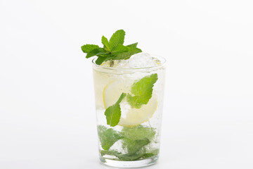 Select focus and close up of an appetizing looking mojito cocktail on a light background