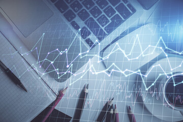 Double exposure of financial chart drawing over table background with computer. Concept of research and analysis. Top view.
