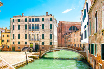 Sunny Venice, Italy. Old colorful buildings, narrow streets and bridges. Monuments of Venice