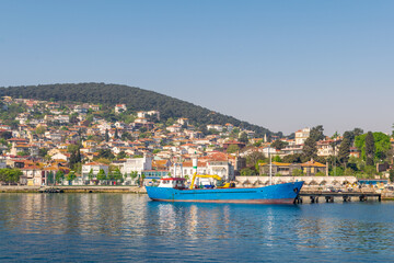 View of Heybeliada island from the sea with summer houses. the island is the second largest one of four islands named Princes' Islands in the Sea of Marmara, near Istanbul, Turkey