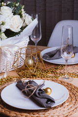 Christmas table setting with bouquet and cutlery.