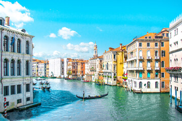 Fototapeta na wymiar Summer in Venice, Italy. Grand canal. View of old buildings, narrow streets and bridges. Monuments of one of the most beautiful cities in Italy.