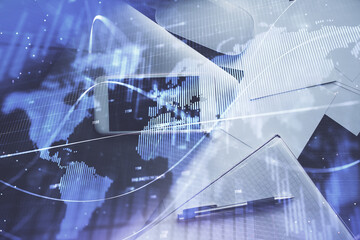 Multi exposure of forex graph hologram over desktop with phone. Top view. Mobile trade platform concept.