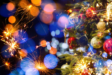 Christmas sparkler with background Christmas light bokeh