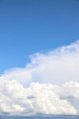 White thick clouds and blue sky background. Sunny day