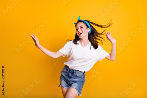 Photo Portrait Of Girl Dancing At Party On Weekend Wearing T Shirt Jeans Shorts Isolated On Vivid Yellow Color Background Wall Mural Deagreez