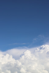White thick clouds and blue sky background. Sunny day