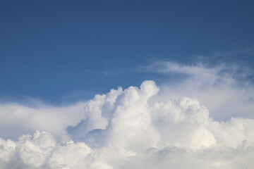 White thick clouds and blue sky background. Sunny day