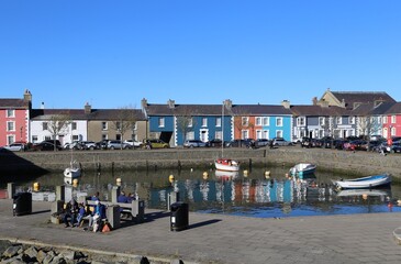 Colourful houses and buildings beside the pretty harbour at  Aberaeron, Ceredigion, Wales, UK.