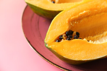 close up of slice of papaya on plate 
