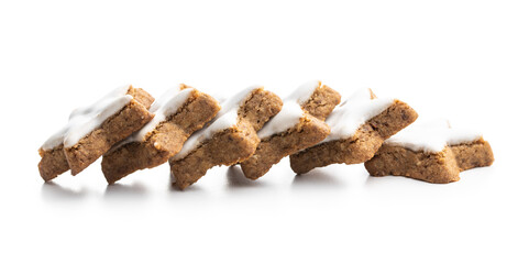 Icing gingerbread stars. Traditional Christmas cookies.