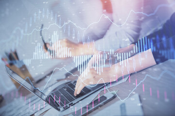 Multi exposure of woman hands typing on computer and financial chart hologram drawing. Stock market analysis concept.