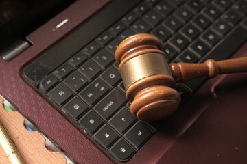 top view of gavel on laptop keyboard 