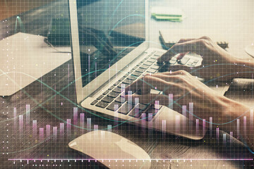 Double exposure of woman hands typing on computer and forex chart hologram drawing. Stock market invest concept.