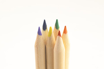 six wooden pencils of different colors of diversity bus