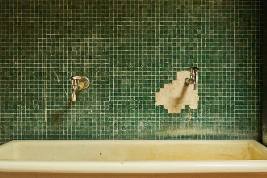 Green tile sink interior in bathroom