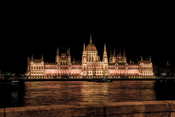 The Hungarian Parliament building illuminated at night. Night landscape of Budapest and Danube River, Hungary
