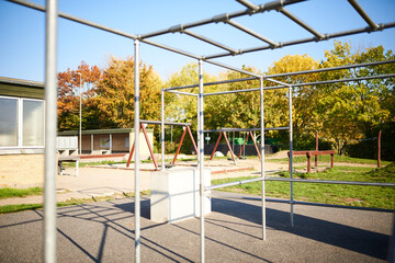Fototapeta na wymiar Playground with swings and metal bars
