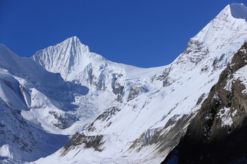 Snow mountains under blue sky in tibet,China