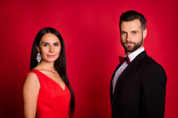Photo of nice couple wear suit dress isolated on red color background