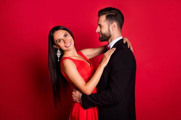 Fototapeta na wymiar Profile photo of optimistic couple dance wear suit dress isolated on red color background