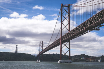 Ponte 25 de Abril. Most famous bridge in Portugal. Lisbon. Red bridge.