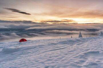Rest in a tent on a mountain ridge with wonderful landscapes around.	