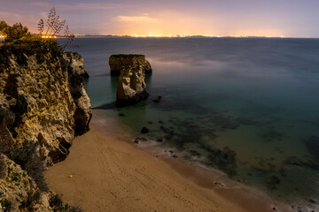 Night beach in, Lagos, Portugal, with aloe on the cliffs. Long exposure.