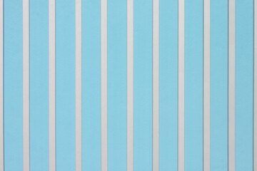 Obraz premium Background and texture of silver steel interspersed with a blue cement wall.