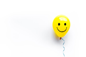 Happiness emotions painted on ballon. Positive mood background. Top view