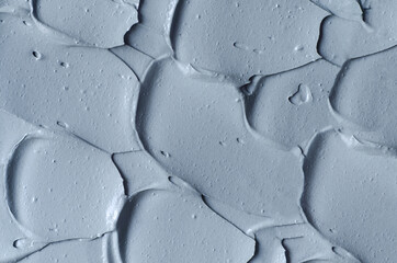 Gray bentonite facial clay (alginate mask, face cream, body wrap) texture close up, selective...