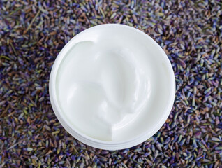 White facial mask (face cream, shea butter, hair mask, body butter) in the small white container. Natural skin and hair concept. Top view, copy space. - obrazy, fototapety, plakaty
