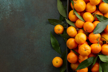 Fresh mandarin oranges with leaves, copy space. Seasonal winter fruits for Christmas.