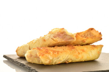 Homemade apple mini strudel, close-up isolated on white.