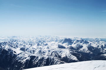 snow covered mountains from the top of Kazbegi
