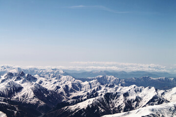 Fototapeta na wymiar snow covered mountains on the way to the top of Kazbegi