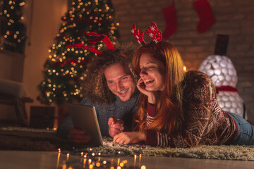 Couple having video call with family on Christmas Eve