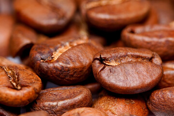 Macro view of fresh roasted Arabica coffee beans, extreme close up photo of fresh coffee beans.