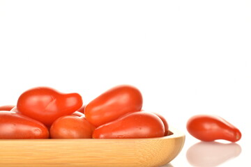Fresh bright red tomatoes in the shape of a strawberry, close-up, isolated on white.