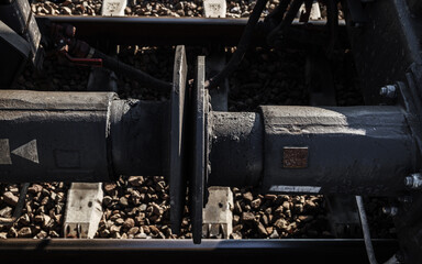 Buffers and chain screw couplers of cargo freight train carriages.