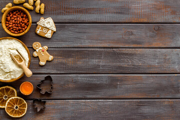 Cooking background with icing gingerbread cookies for Christmas, top view