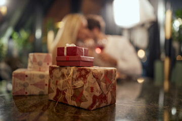 A young couple in love enjoying anniversary celebration in restaurant. Together, Valentine's day, celebration